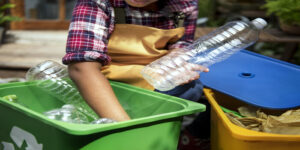 Closeup of hands separating plastic bottles