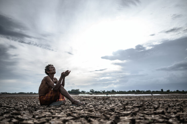 An elderly man was sitting asking for rain in the dry season, gl